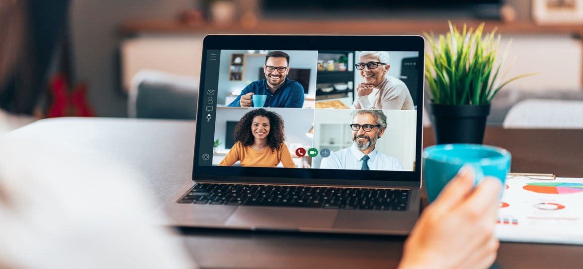 5 Ways to Improve Company Culture Image: Photo of someone sitting at desk with laptop open. There are four people on the screen wearing business attire.