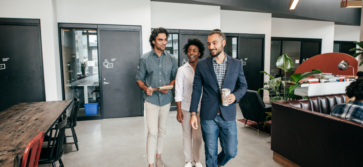 Three tech recruiters collaborating in the common area of an office